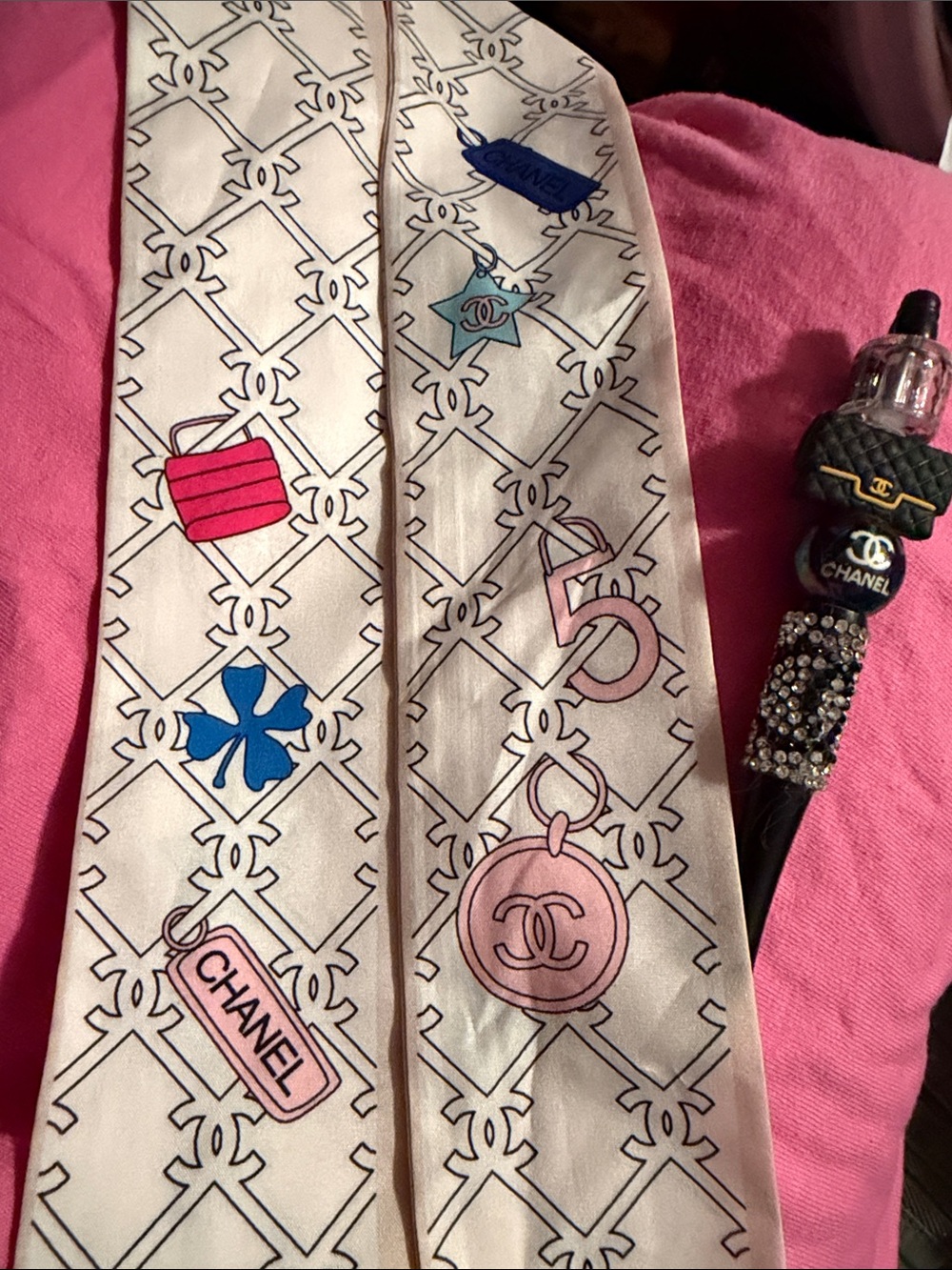 Cream Silk Twilly with Pink & Blue Motifs asking with homemade ink pen